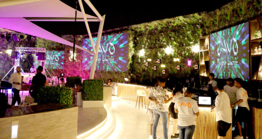 Cavo rooftop at night: Cavo Rooftop lounge glowing under the stars with a panoramic view of Manama