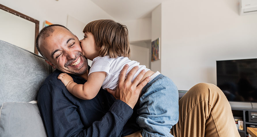 Father and child sharing a joyful moment in Bahrain, Father’s Day 2025