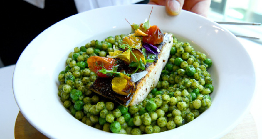 Crisp-skinned Mediterranean salmon served over pesto fregola