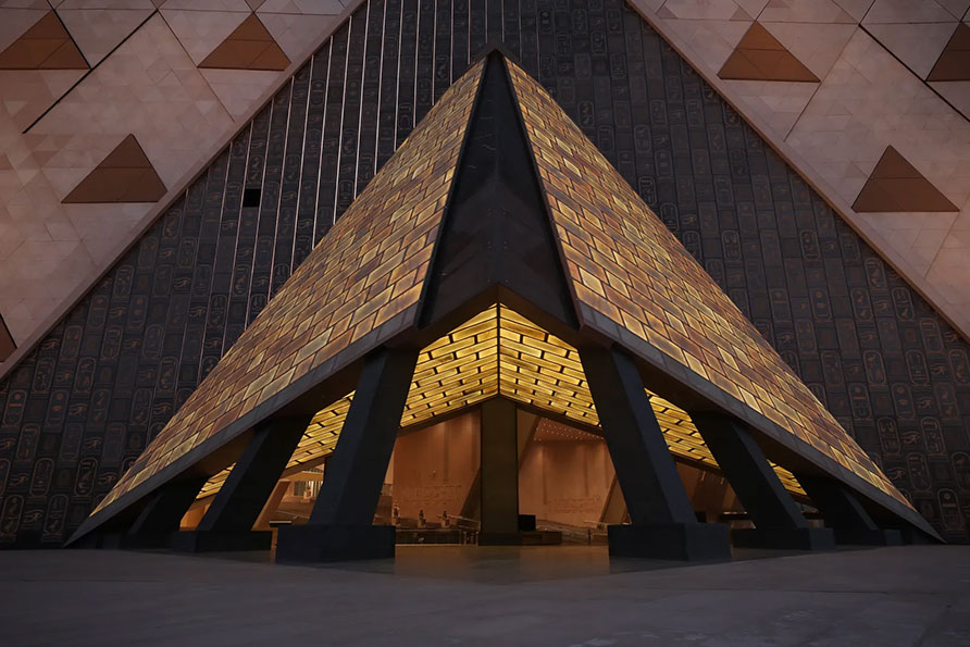 grand egyptian museum exterior beside the pyramids of giza